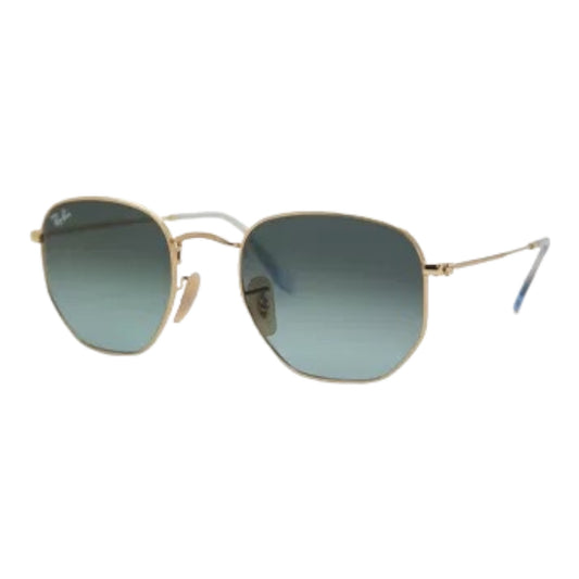 Image description: Frame details of Rb 3548 N eyeglasses by EssilorLuxottica. Unisex design in Gold color with Geometric shape and Full Rim style, crafted from Metal frame and Crystal lenses in Blue gradient grey. Provides 100% UV Protection."